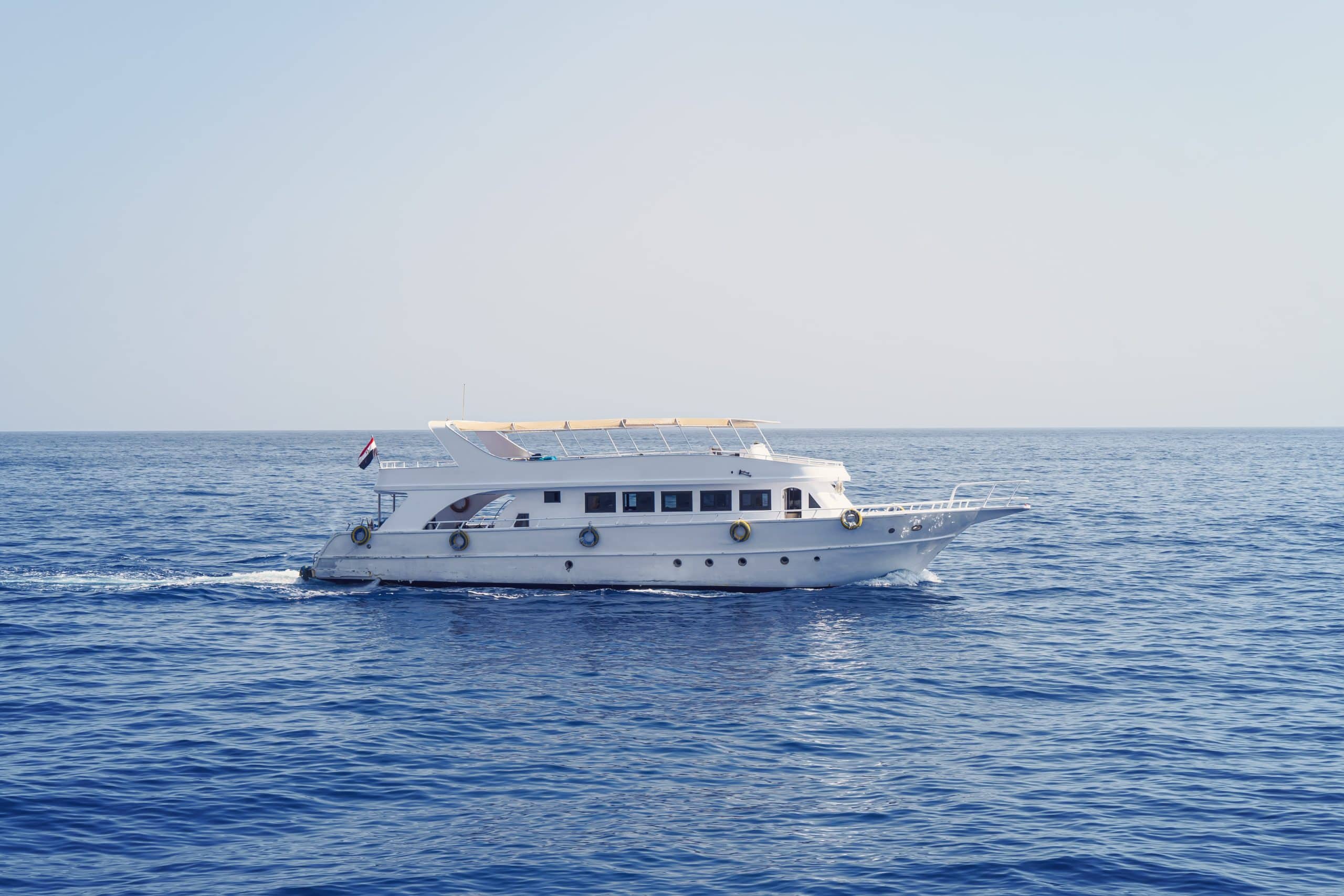 luxury-private-motor-yacht-way-tropical-sea-with-bow-wave-min